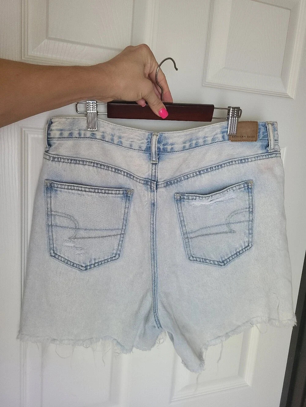 American Eagle Ripped Denim Baggy Mom Shorts in a light wash.